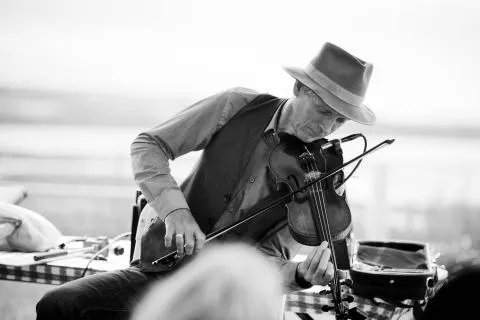 Photo of Roy Johnstone playing the fiddle.